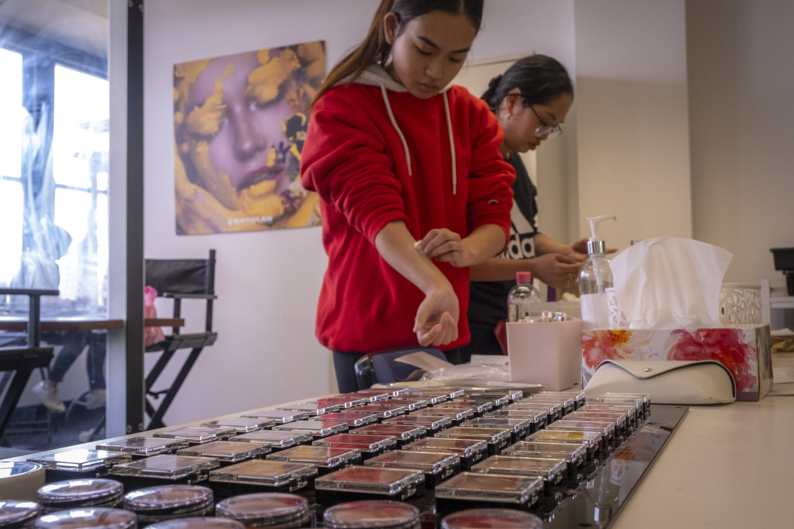 TAFE Make uUp student selecting colours from make up samples by Ant Portraits 2024