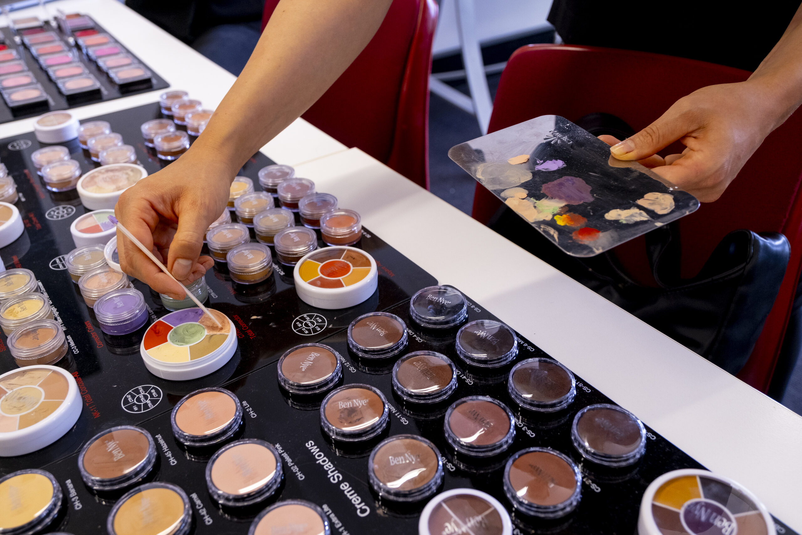 TAFE Make Up Student adding  make up colours from samples to a colour palette by Ant Portraits 2024